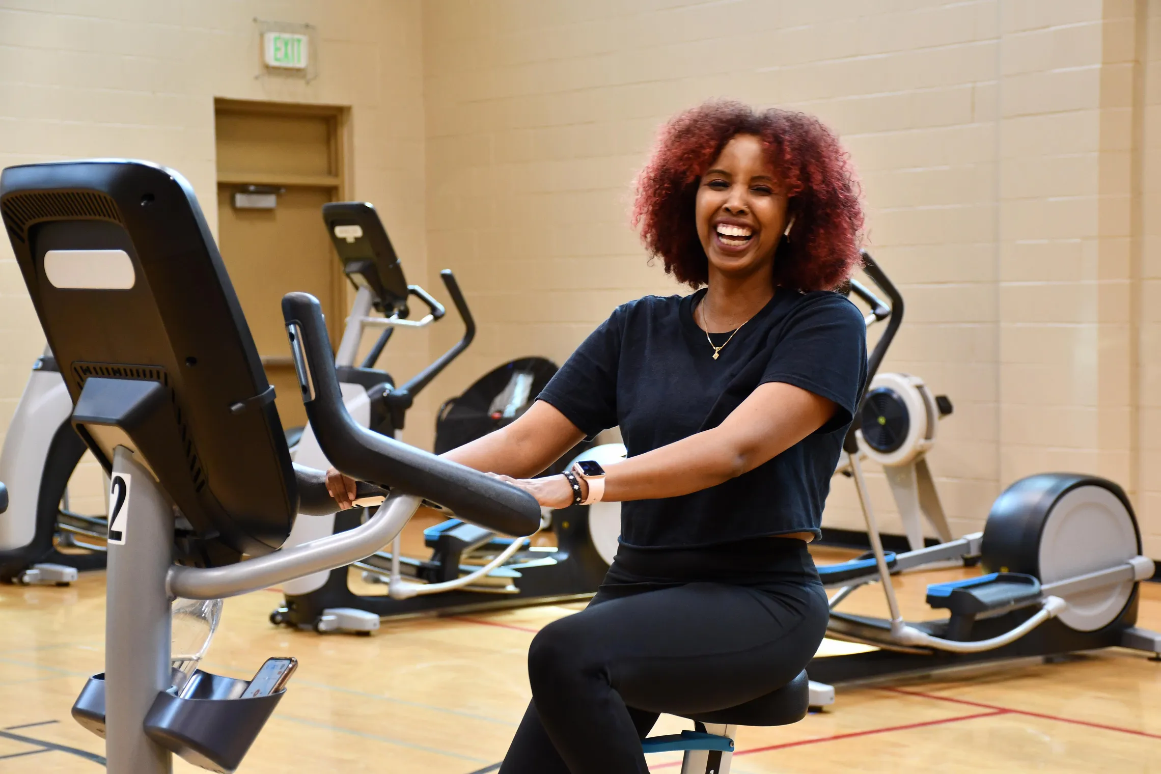 working out on cardio equipment at the Y
