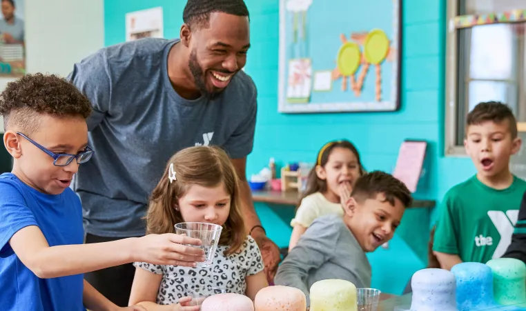 children and Y staff leader at YMCA afterschool program doing STEM activity