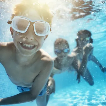 children swimming in the pool