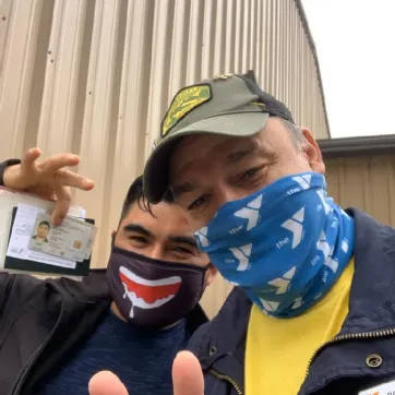 Latino man receives documents at the Y