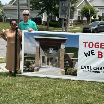 Carlvena Foster and Lynn Lomax  with banner