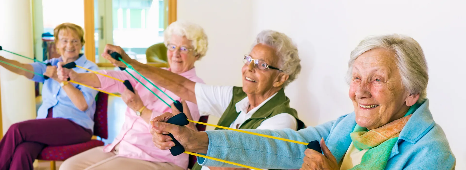 seniors group exercise with bands