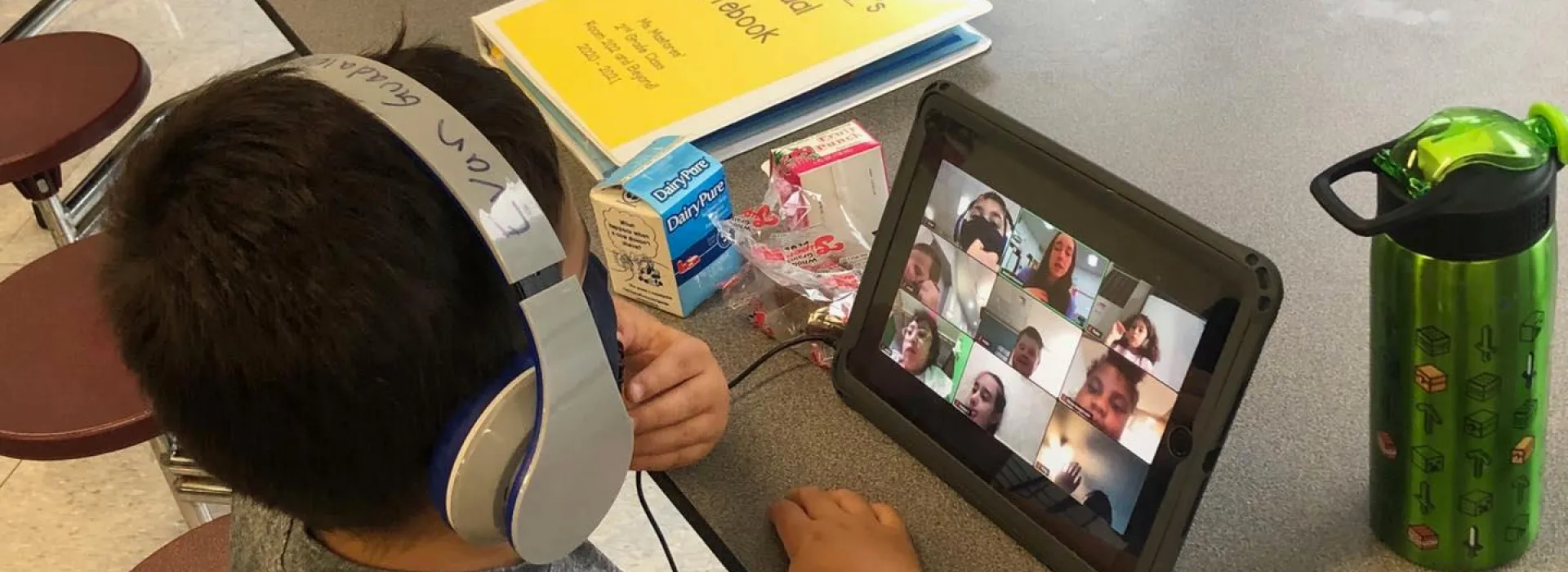 boy with headphones at remote learning
